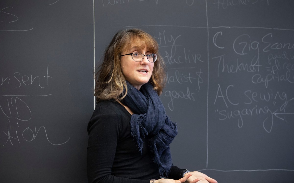 Caroline Light stands at the blackboard.