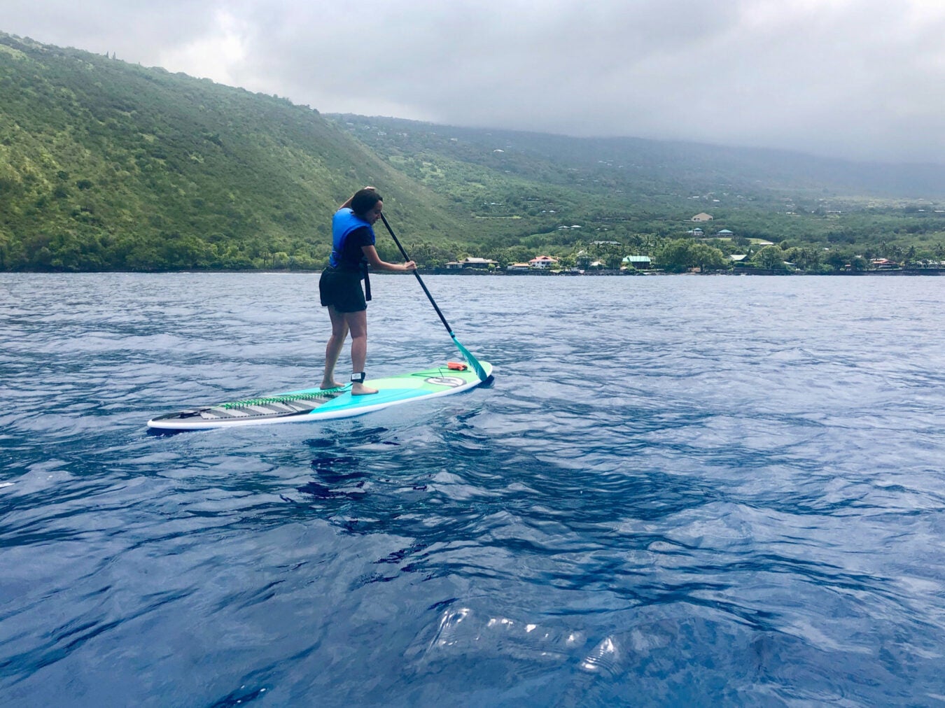 Girma paddle boarding in Hawaii