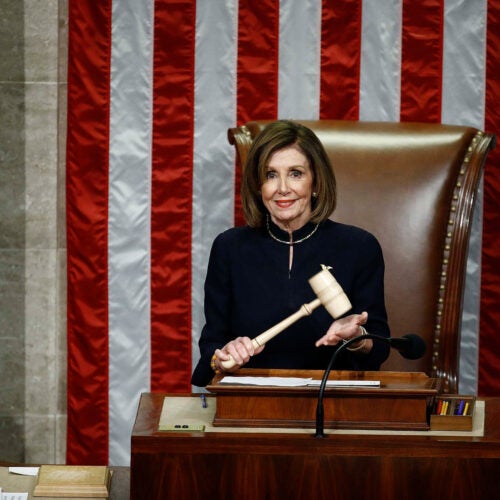 House Speaker Nancy Pelosi holds the gavel.
