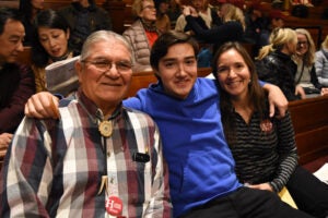 Student with grandfather and mother in Sanders Theatre.