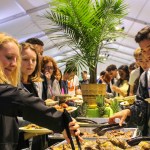 Taste of the Islands food bar with students lining yo