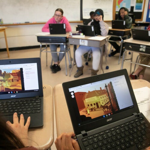 Students in classroom with computers.