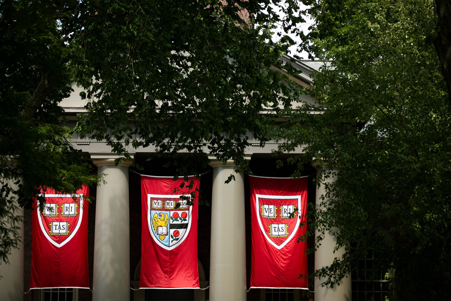 Veritas flags hanging at Harvard's Memorial Church.