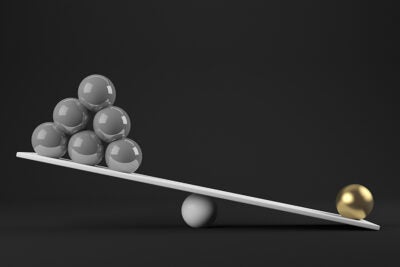 Balls balancing on a scale.