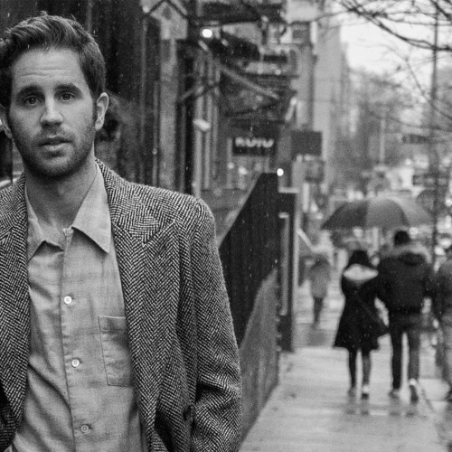 Actor Ben Platt on city street.