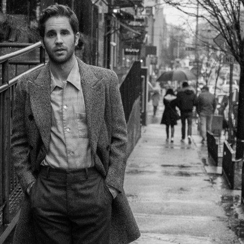 Actor Ben Platt on city street.