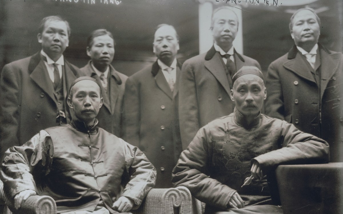 A photo of several Chinese men.