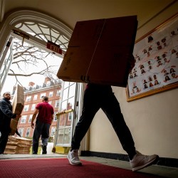 People with packing boxes.