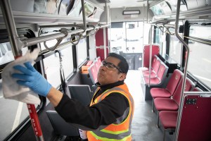 Cleaning a shuttle bus.