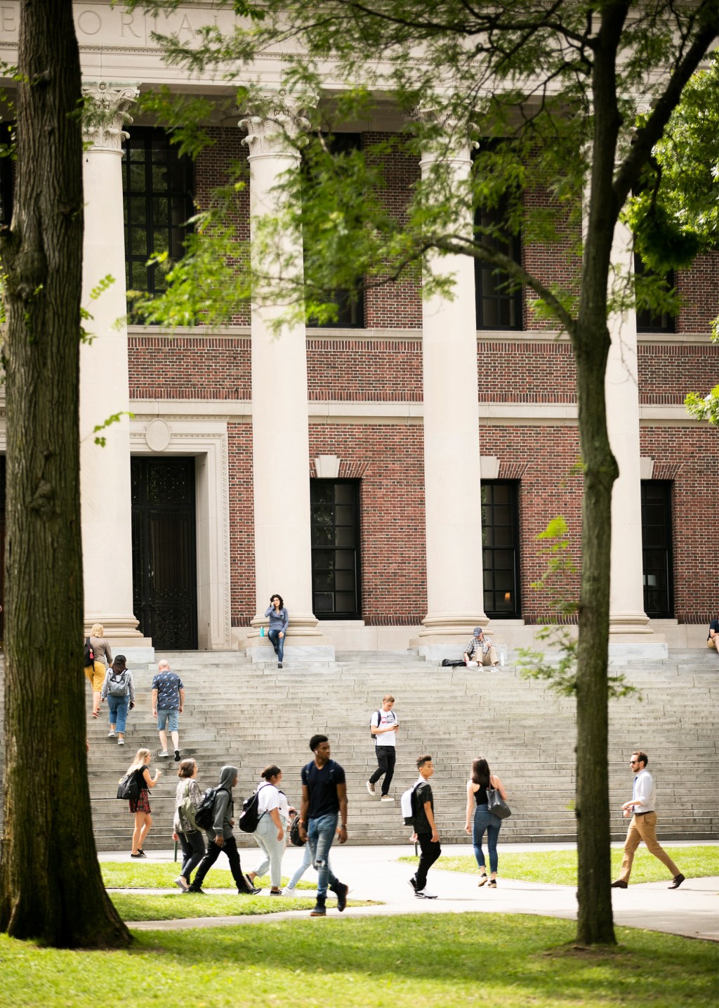 Students flow in and out of Widener Library.