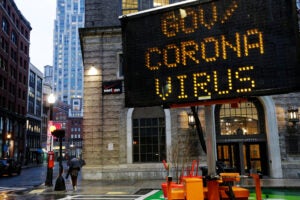 Mobile road sign in Boston directs people to government coronavirus website.