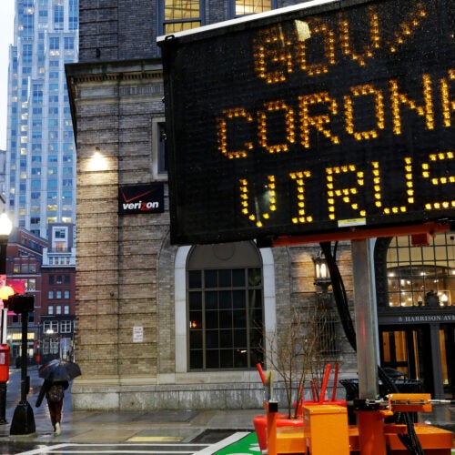 Mobile road sign in Boston directs people to government coronavirus website.