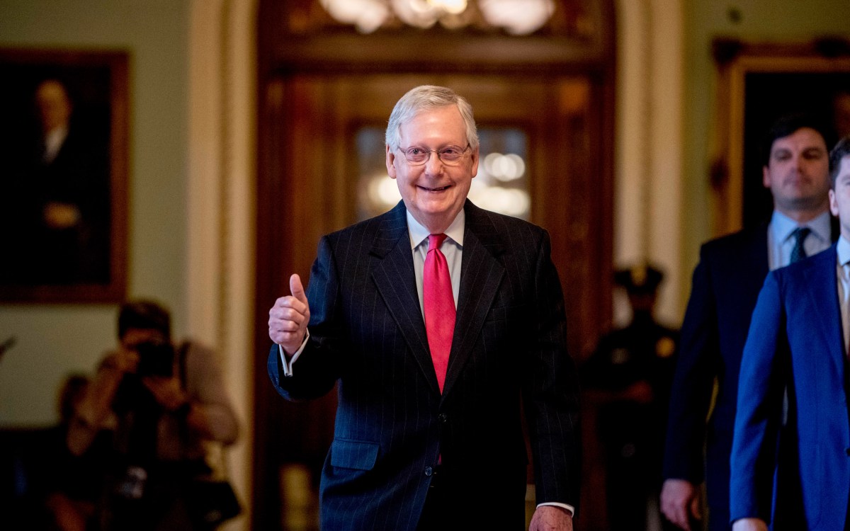 Senate Majority Leader Mitch McConnell gives a thumbs up