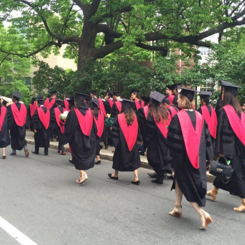 Harvard Medical School graduates walking,
