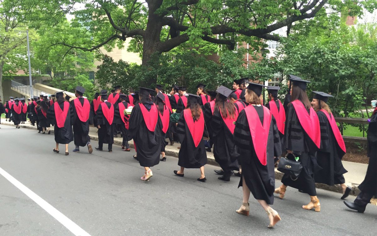 Harvard Medical School graduates walking,