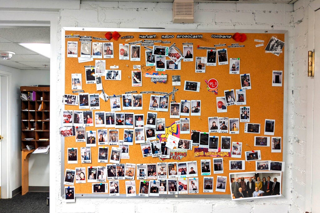 WHRB studios with photos on a bulletin board are pictured.