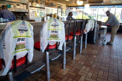 Customer picks up order in Waffle House.