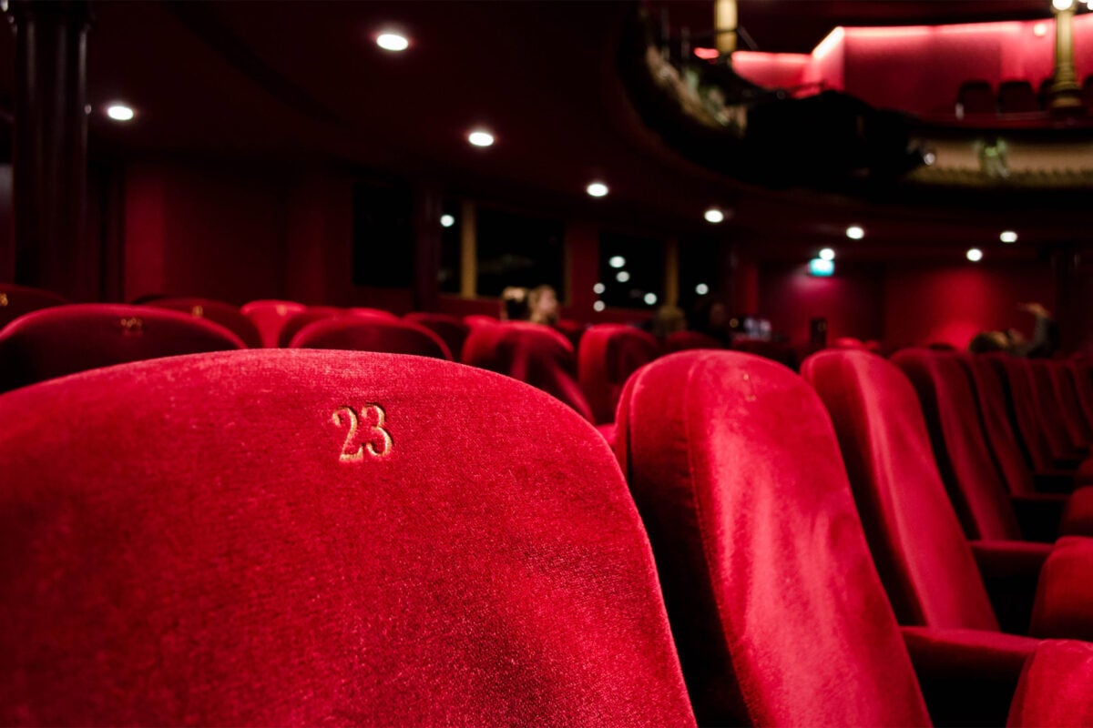 Empty theater chairs.