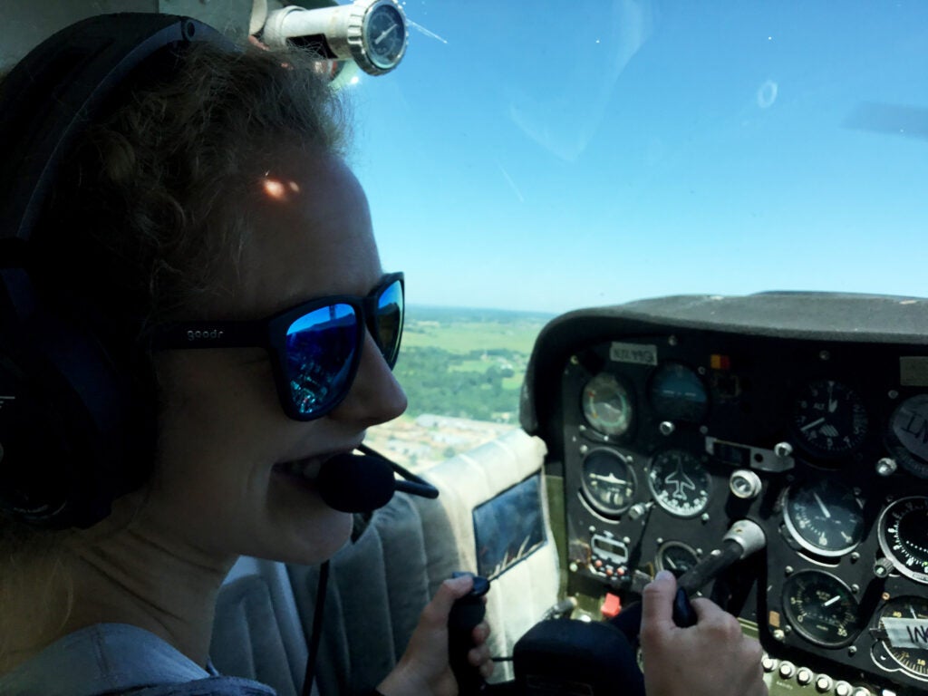 Lauren Spohn piloting a plane.