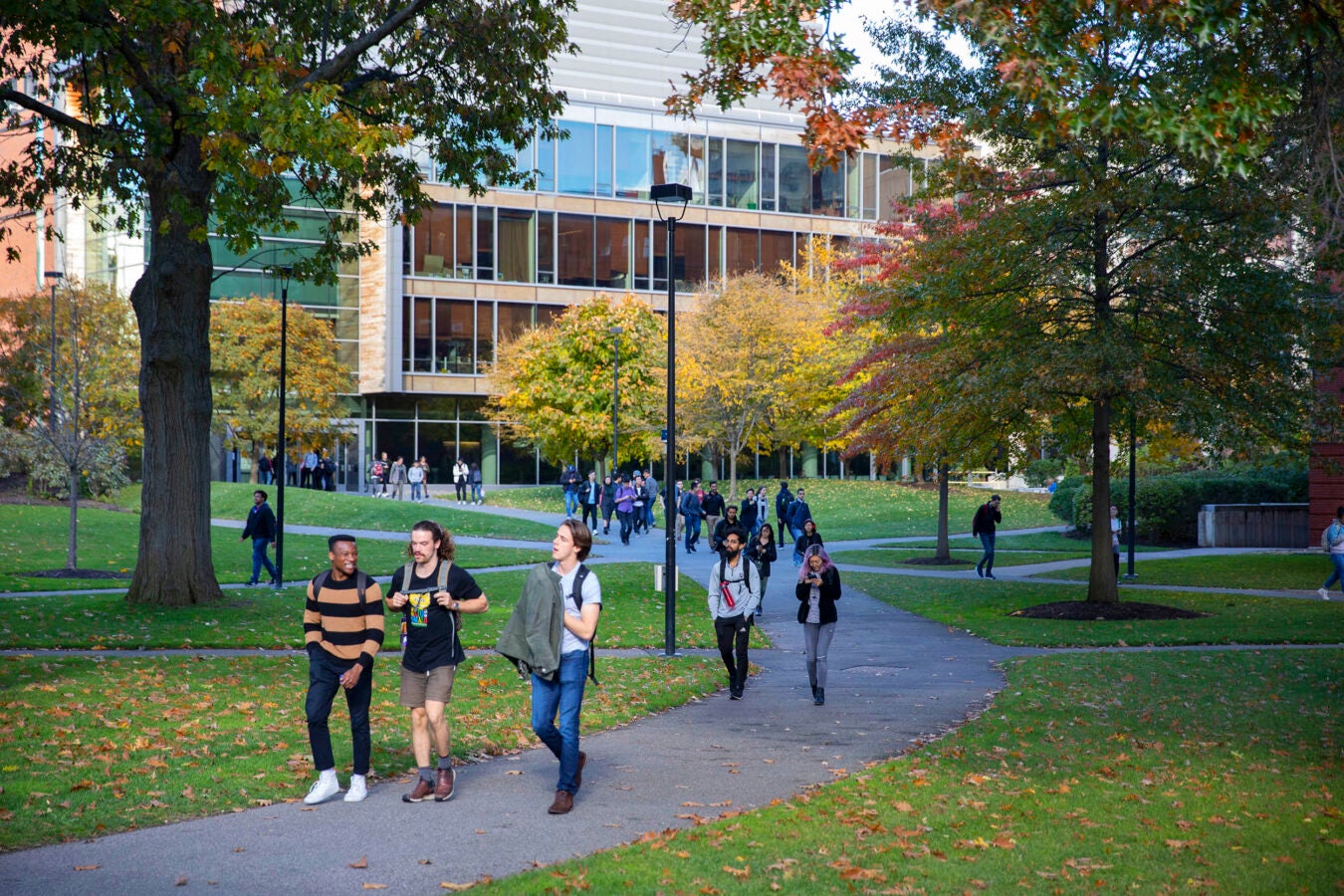 Students leave class outside the Northwest Labs in autumn.