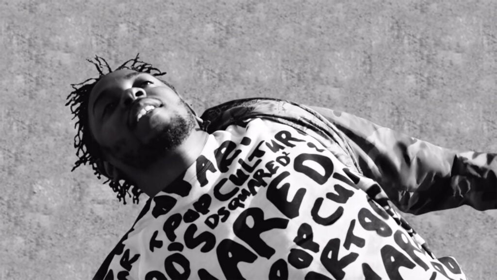 Kendrick Lamar falling in "Alright" video.