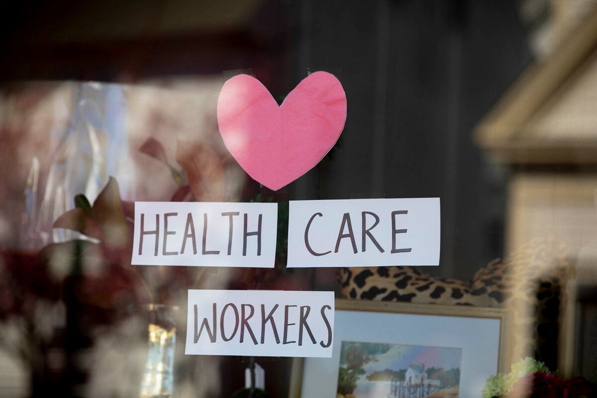 Thank you sign for health care workers in a window.