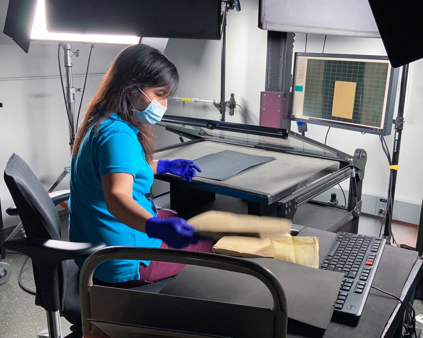 Penny Xu scanning a book.