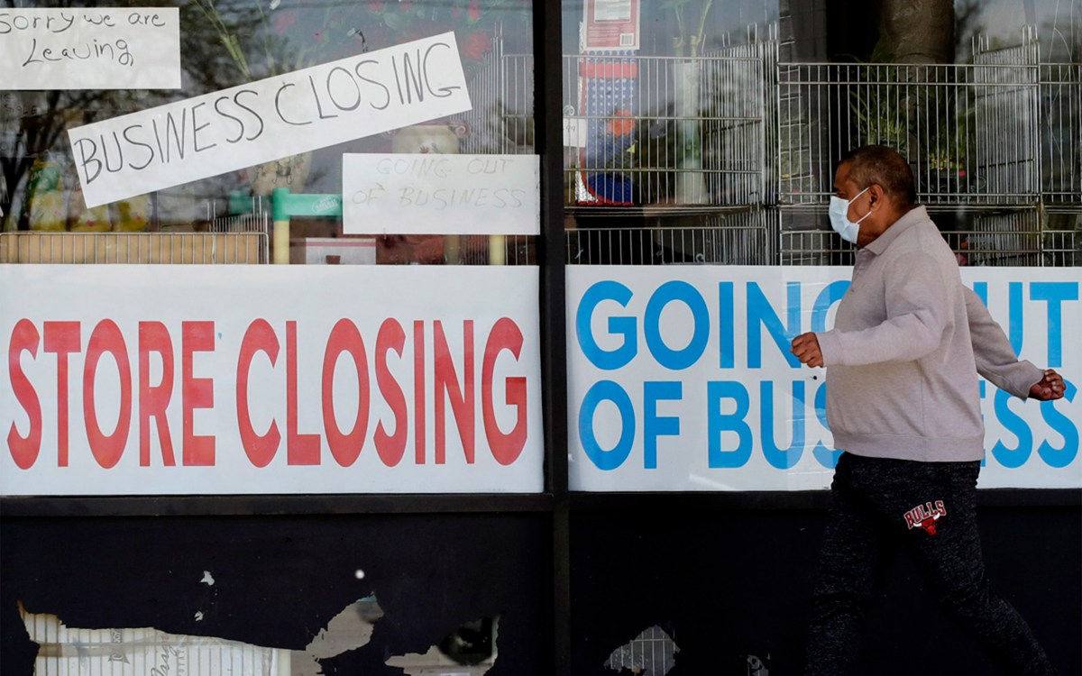 Store closing signs in window.