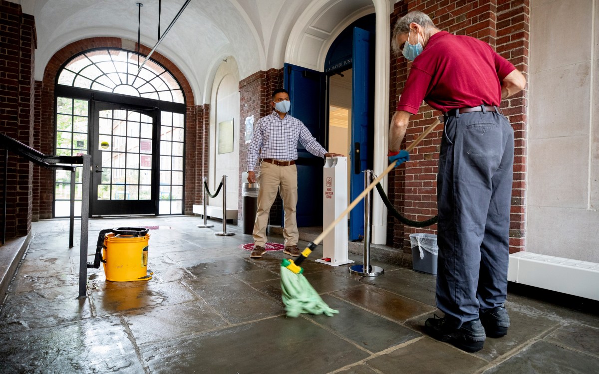 Elson Callejas overseeing cleaning at Lowell House.