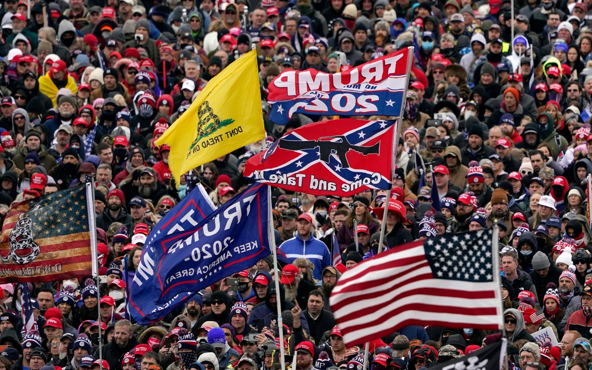 Jan. 6, 2021, file photo, supporters listen as President Donald Trump speaks.