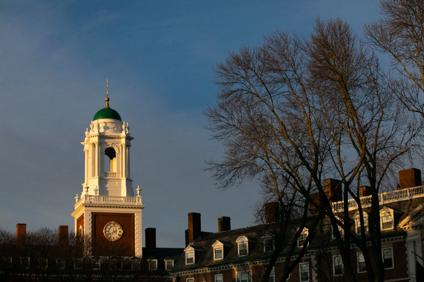 The cupola with green dome of Eliot House is pictured.