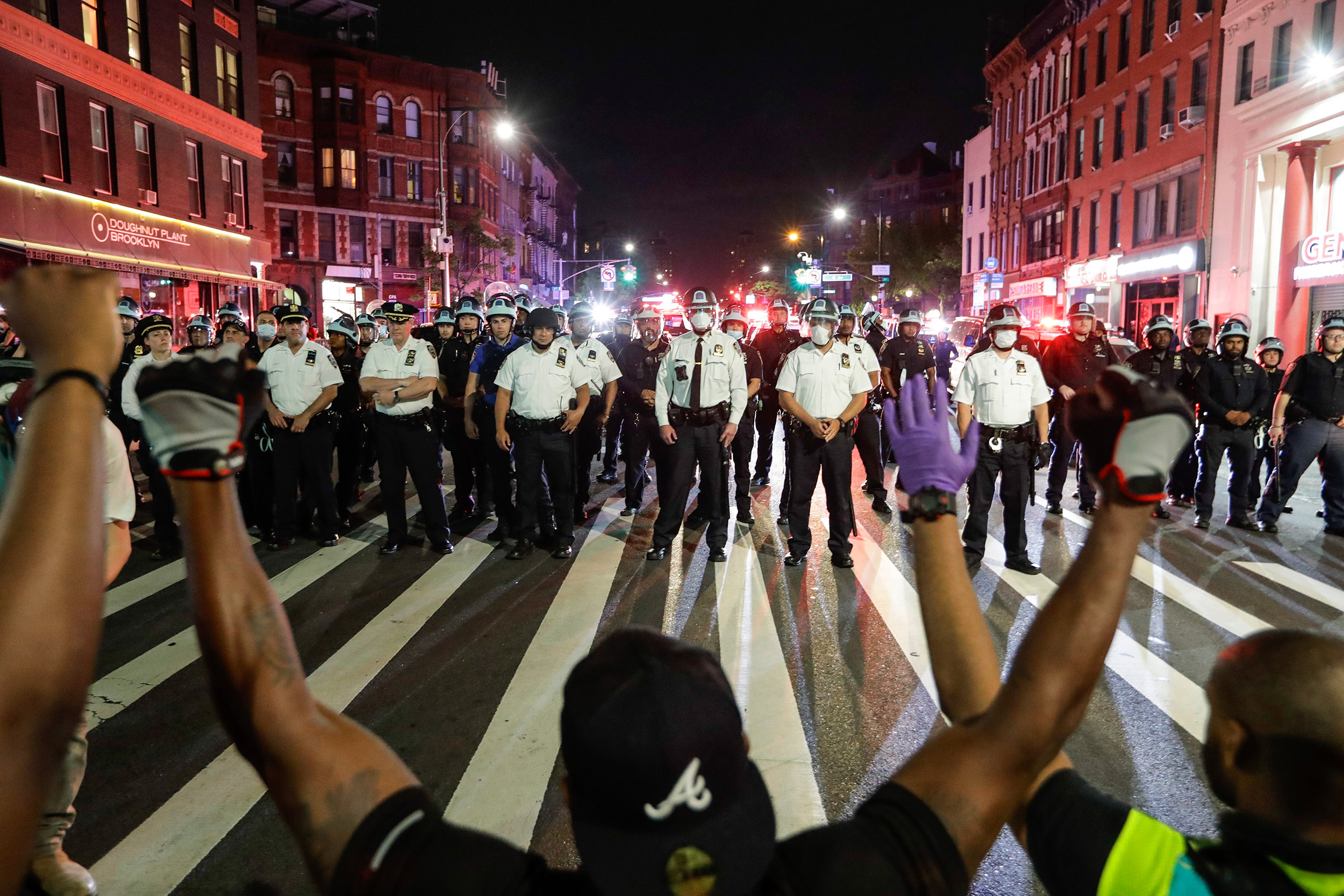 Healthcare workers kneel at Franklin Field to protest racial inequality in  medicine