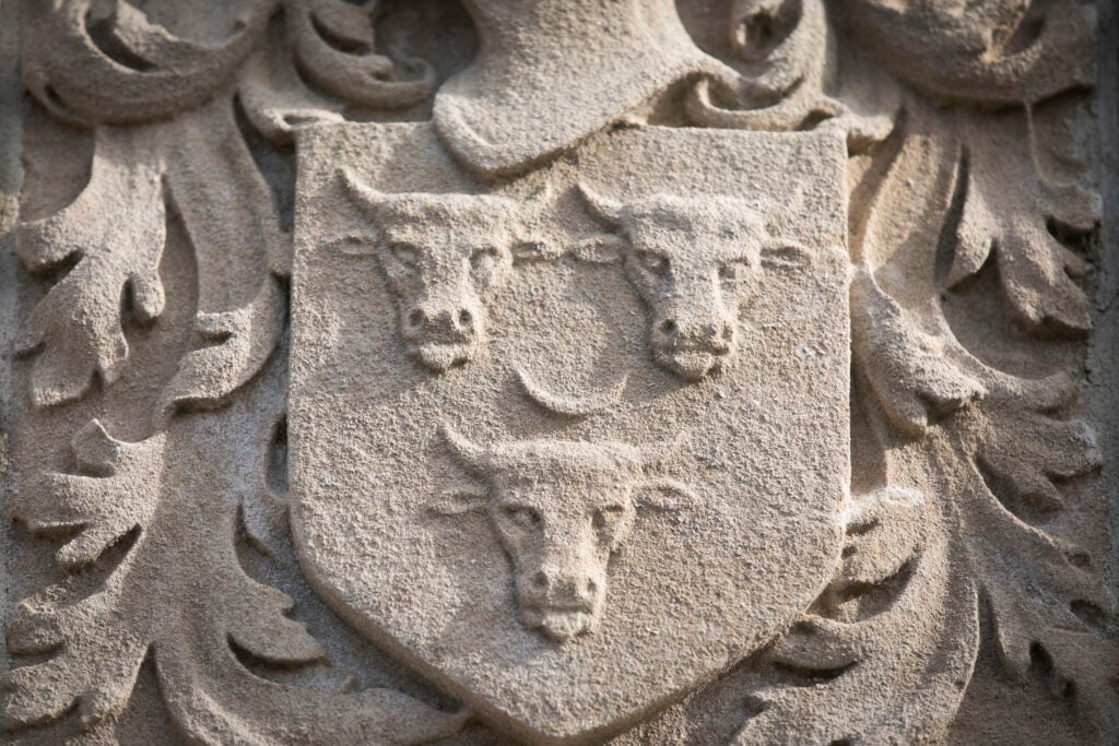 Three cattle decorates the gate surrounding Winthrop House.