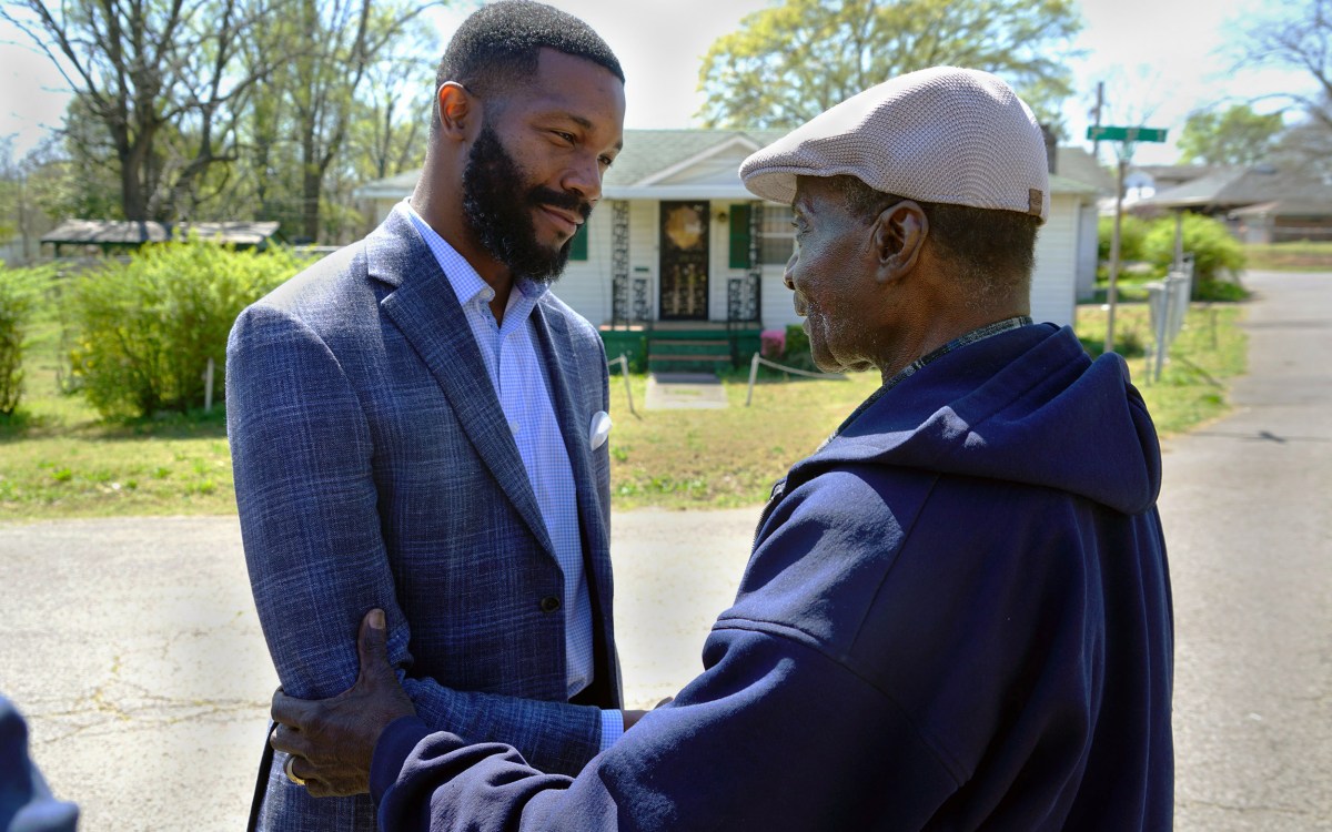 Mayor Woodfin and a citizen.