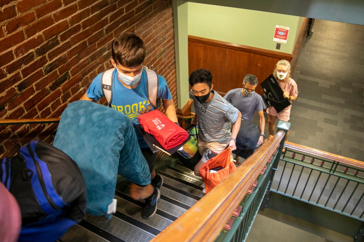 Keegan Harkavy '25 leads the way up the stairs with his parents Brad and Mador Harklavy taking up the rear.