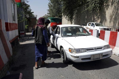Taliban checking cars.