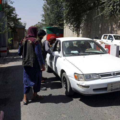 Taliban checking cars.