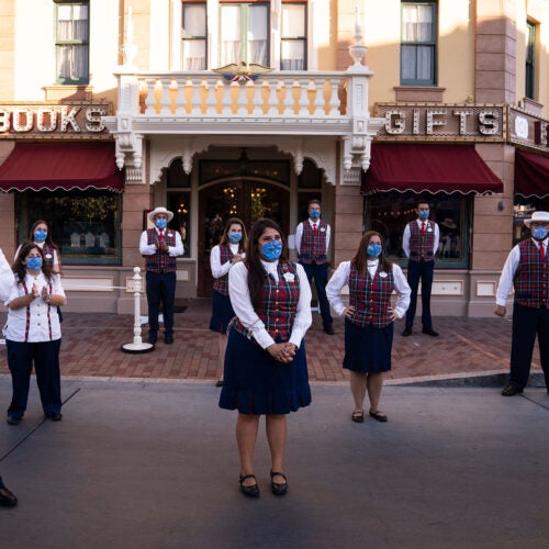 During a meeting at Disneyland in Anaheim, California, employees wear masks and stand socially distanced. The Disney Co. has a comprehensive approach to COVID and its employees' well-being.