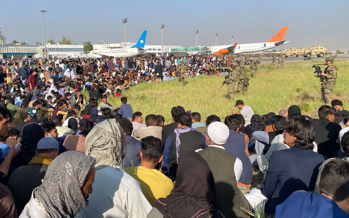 Kabul airport with soldiers and Afghans.