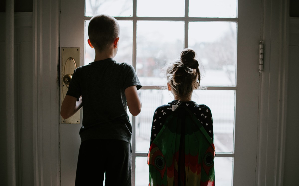 Children looking out the window.