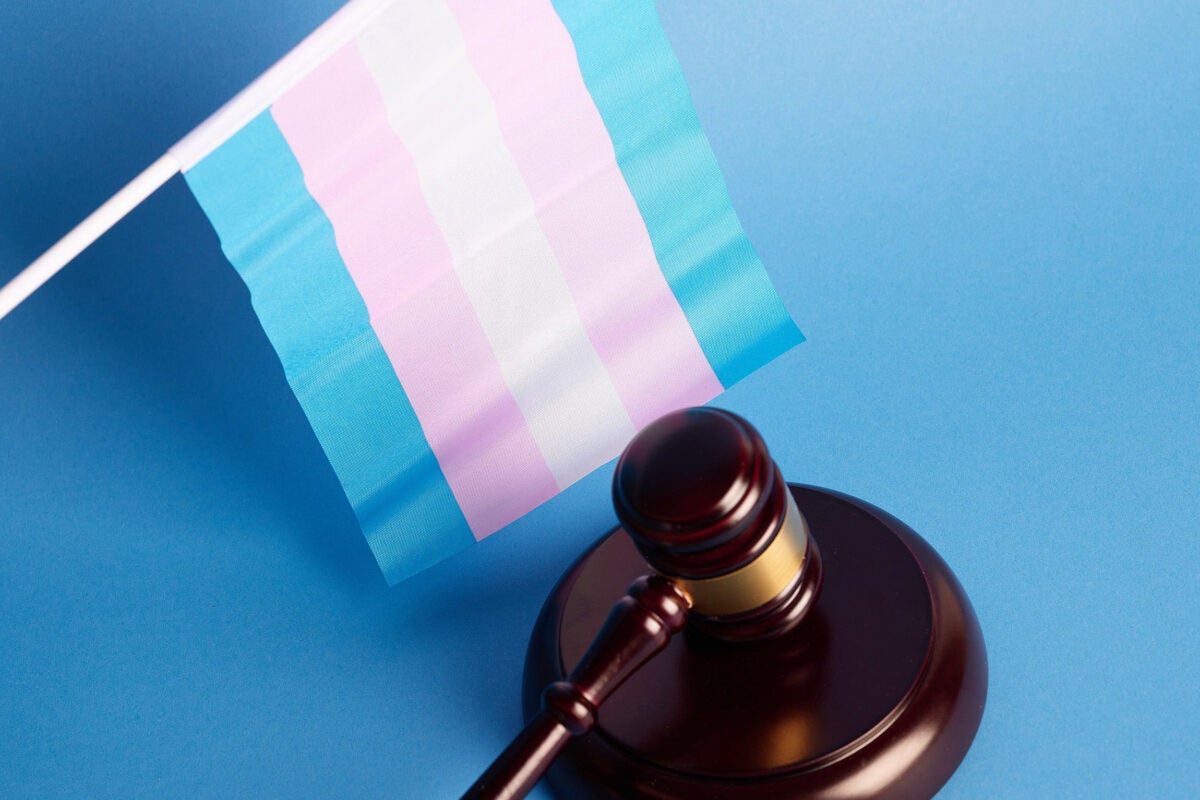 A transgender flag and court gavel.