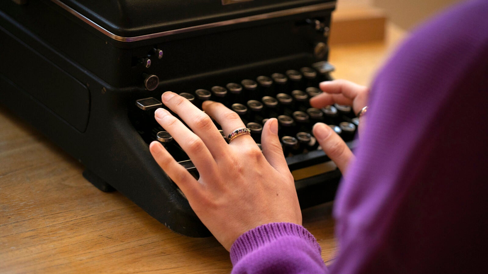 Hands on a typewriter.