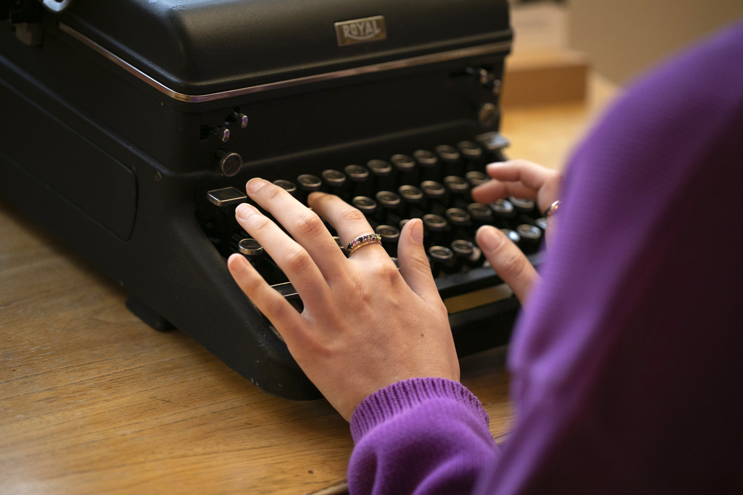 Hands on a typewriter.