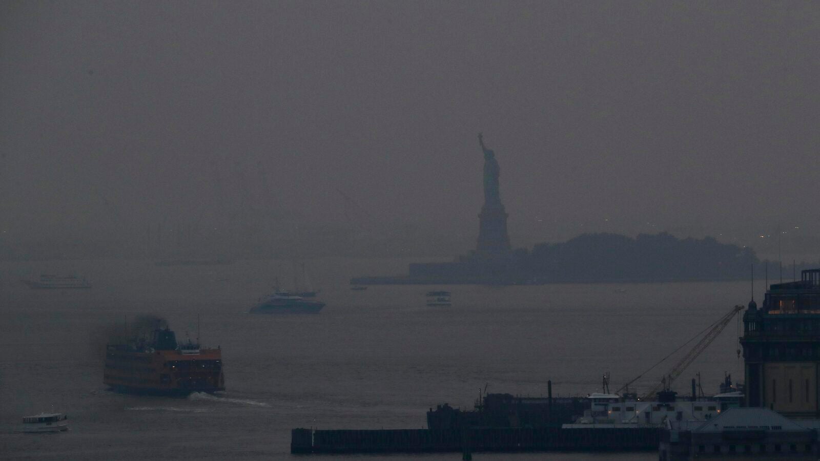 Statue of Liberty shrouded in smoke from wildfires on West Coast.