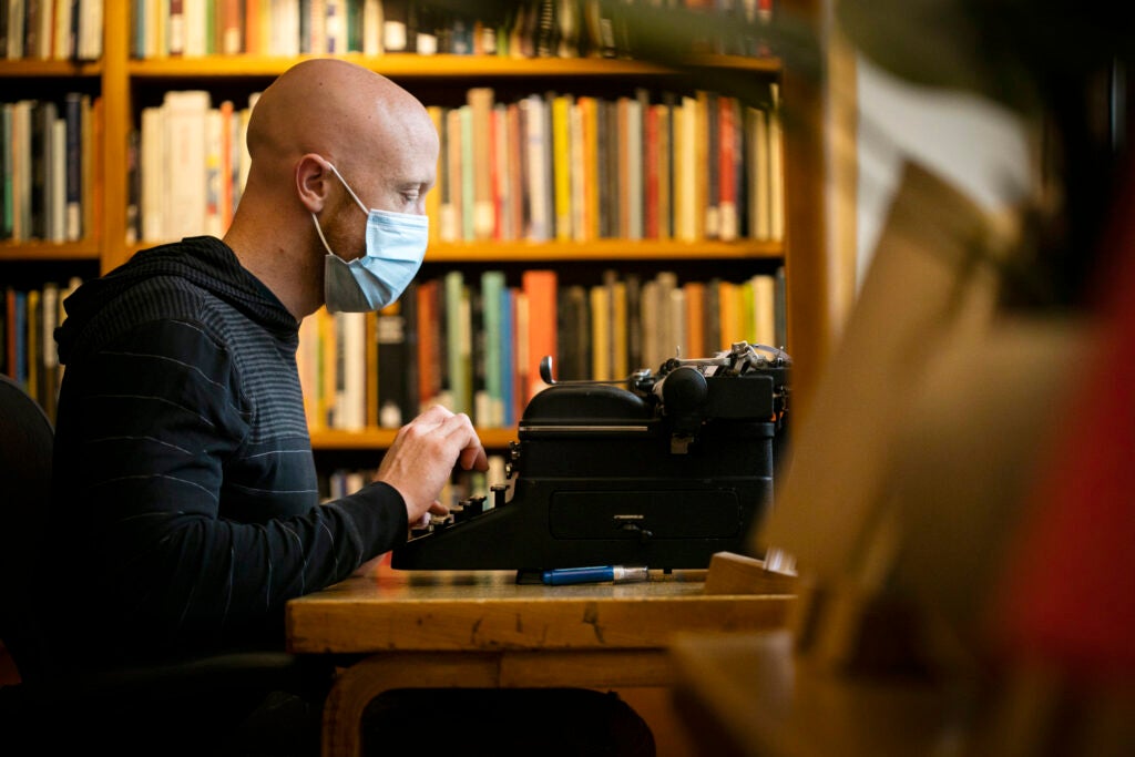 Benjamin Wright using typewriter.