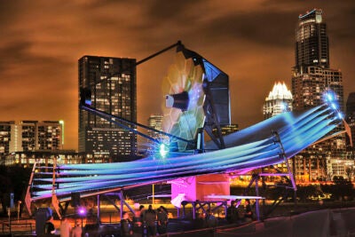 James Webb Space Telescope model at South by Southwest with Austin skyline in back.