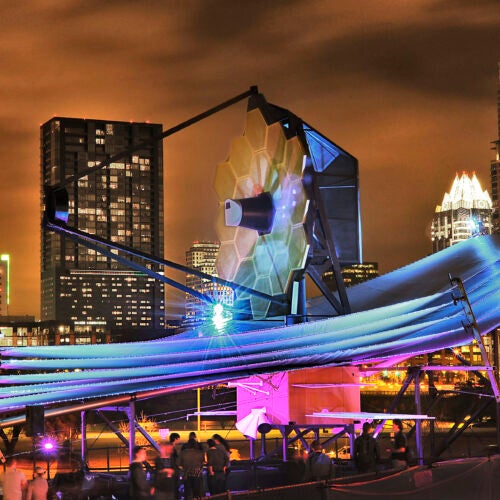 James Webb Space Telescope model at South by Southwest with Austin skyline in back.