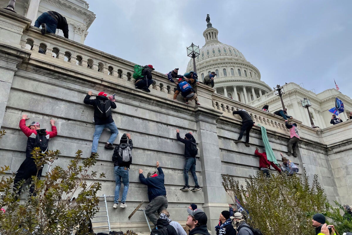 Trump supporters scale west wall of the the U.S. Capitol Jan. 6.