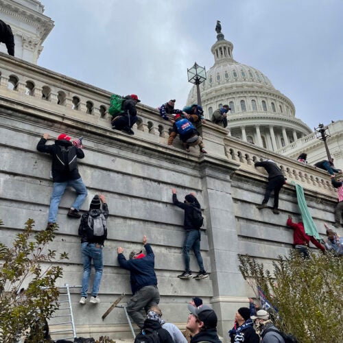Trump supporters scale west wall of the the U.S. Capitol Jan. 6.