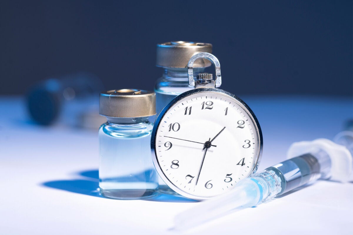 Vaccine bottles and a clock.